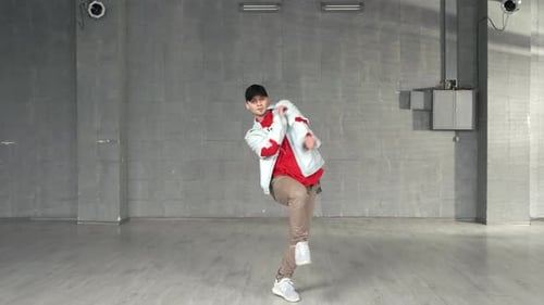 Attractive Guy Dancing Hiphop on City Street