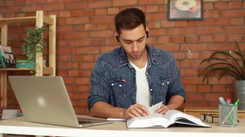 Young Adult Studies with Book and Laptop
