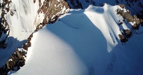 People on the Top of a Snowy Mountain