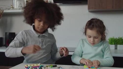 Portrait of Lovely Multiethnic Elementary Age Kids Playing Developing Game Indoors