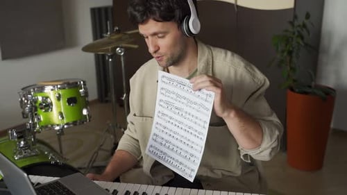 Musician Explaining Music Notes During Online Music Lesson