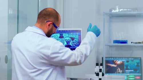 Scientists Collaborating on Research in Advanced Laboratory