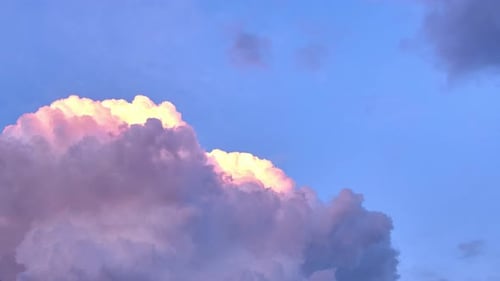 Large cumulus clouds, blue sky, sunset clouds colours