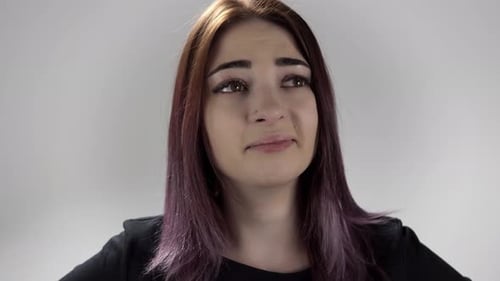 Portrait of Upset Girl with Coloured Hair Almost Crying and Moving Her Head to the Sides