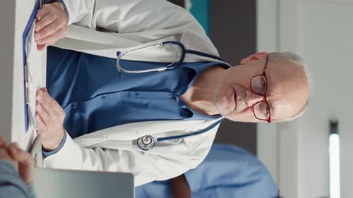 Doctor Consults With Patient in Office
