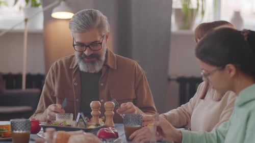 Family Enjoying Dinner Together at Home