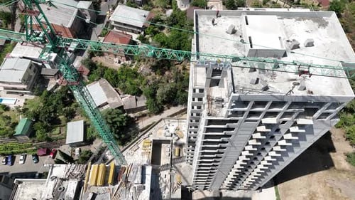 Working process on high building construction site. Construction of a residential buildings