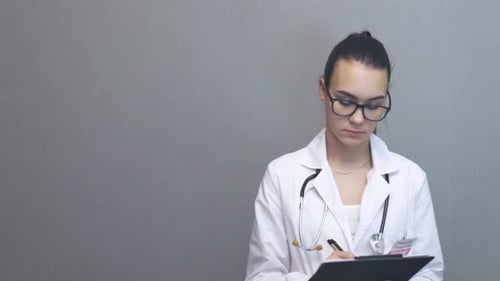 Young Female Professional Doctor Medicine Worker Talking to Camera Prescriptions