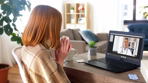 Woman Consults Doctor Via Video Call at Home