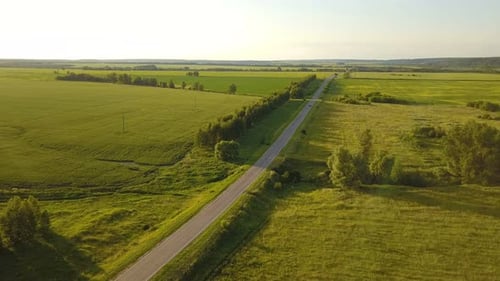Scenic Aerial View of Road Through Rural Landscape