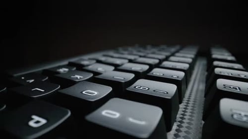 Close-up view of computer keyboard. Macro soft focus dolly shot