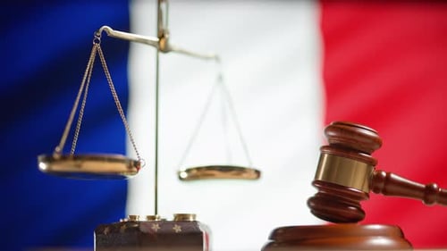 Scales of Justice with French Flag Backdrop