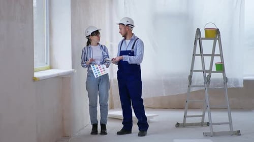 Home Renovation Team Choosing Colors in Bright Room