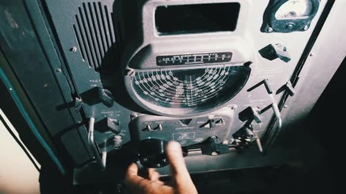 Hand Adjusting Knob on Vintage Electrical Panel