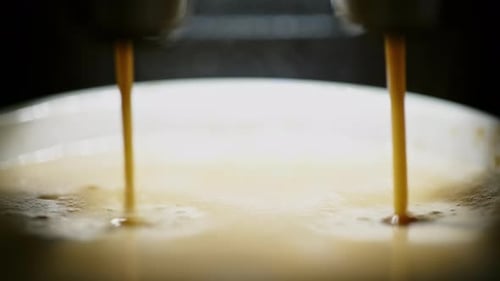 Close Up Espresso Preparing in White Ceramic Cup From Automatic Coffee Maker