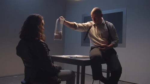 Intense Interrogation Scene: Investigator Presents Evidence