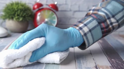 Hand in Glove Wipes Down Surface
