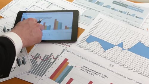 Business People Developing a Business Project and Analyzing Market Data Information