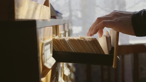 Man Opens Database Drawer, Young Librarian Opens Library Card Index, Archive, Database, Library