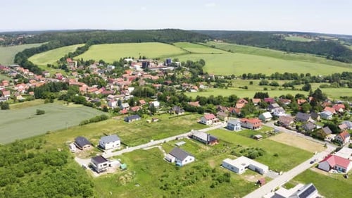 Aerial Drone Shot Houses in a Picturesque Village in a Hilly Rural Area Drone Turns to the Left