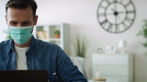 Man Working from Home Wearing Face Mask