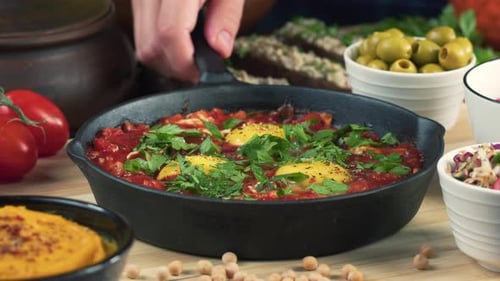Close Up of Shakshuka Dish Sprinkled With Pepper