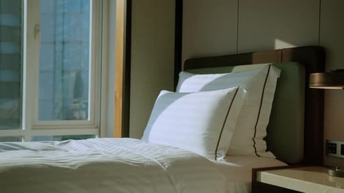 close up white beige soft pillows on bed and blanket bedroom i