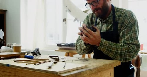 Craftsman working on clay sculpture 4k