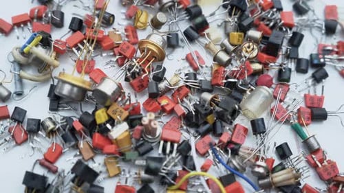 Electronic Components Scattered on a White Surface