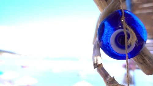 Blue Evil Eye Charm Hanging on Beach