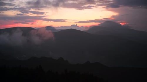 Mountain Range at Sunset with Clouds