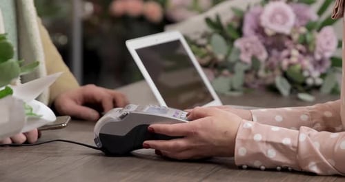 Customer Using Mobile Payment at Point of Sale