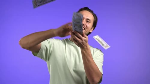 Man with Happy Face Scatters Money