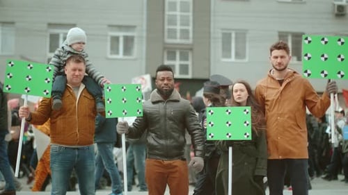 Diverse People Protesting with Green Screen Signs