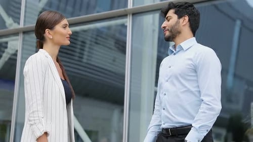 Business People Near Office Ending Meeting With Shaking Hands