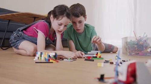 Children Building Together on a Living Room Floor