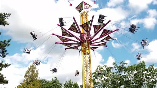 Amusement Park Ride Spinning in the Daytime