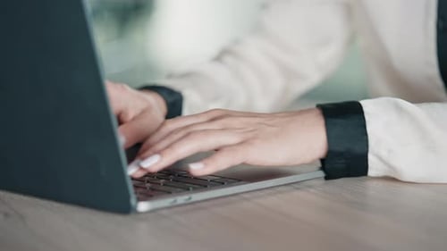 Close up Hands Typing on Laptop Keyboard
