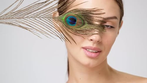 Woman Smiles with a Peacock Feather Decoration