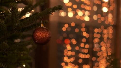 Christmas Tree Ornament with Sparkling Lights Background