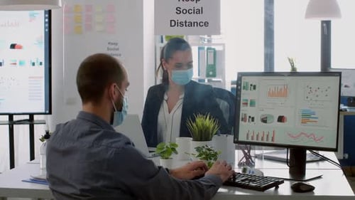 Business Team with Protection Face Masks Working Together in Company Office