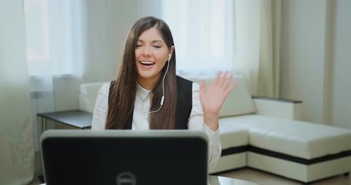 Cheerful Woman on Video Call Waving