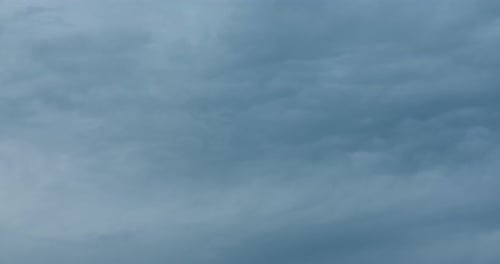 Clouds Moving Slowly in Overcast Sky