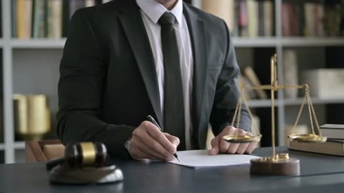 Close Up Shoot of Lawyer Hand Checking Document in Court Room