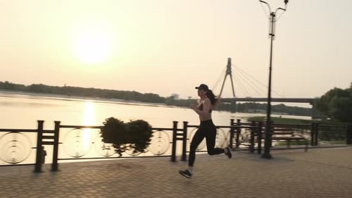Active Fitness Woman Runner Jogging in Sunny Park Summer Day Outdoors
