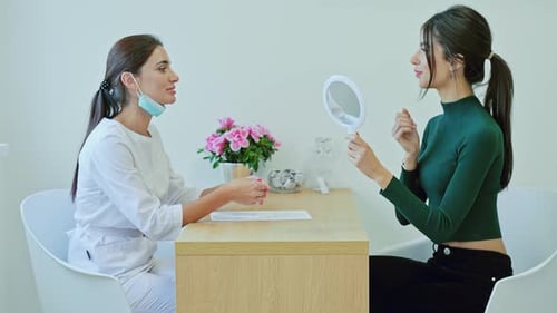 Woman at Clinic with Medical Professional