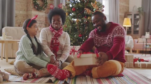 Family Christmas Celebration with Gift Exchange and Hugs