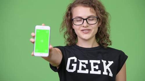 Girl Holding Up Mobile Phone with Green Screen