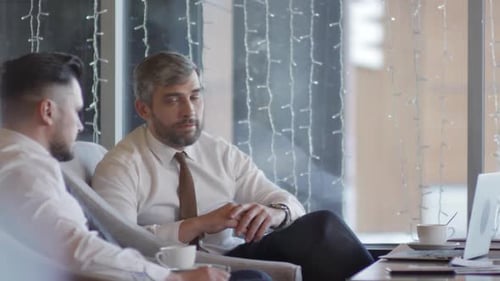 Businesspeople Communicating at Coffee Break