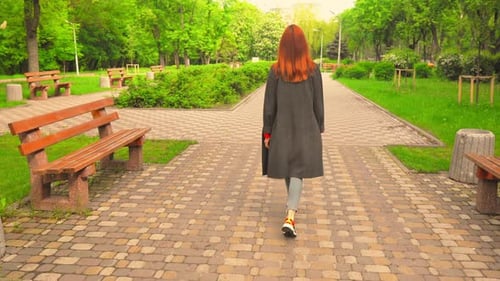 Red-Haired Girl Turned Back Walks By Road